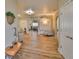 Elegant entryway with hardwood floors, arched doorways, and ample natural light at 676 Allegheny Dr, Sun City Center, FL 33573