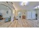 Spacious entryway with hardwood floors and an open view to the living room at 676 Allegheny Dr, Sun City Center, FL 33573