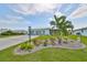 House exterior with well-maintained landscaping and a three-car garage at 676 Allegheny Dr, Sun City Center, FL 33573