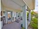 Inviting front porch with rocking chairs and decorative planters at 676 Allegheny Dr, Sun City Center, FL 33573