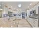 Open concept kitchen with granite counters and ample cabinet space at 676 Allegheny Dr, Sun City Center, FL 33573