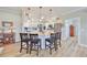 Island kitchen with granite countertops and white cabinets at 676 Allegheny Dr, Sun City Center, FL 33573
