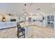Open kitchen with large island, granite counters & breakfast bar at 676 Allegheny Dr, Sun City Center, FL 33573