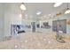 Kitchen boasts granite countertops, white cabinets, and a large pantry at 676 Allegheny Dr, Sun City Center, FL 33573