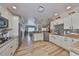 Modern kitchen featuring granite countertops and stainless steel appliances at 676 Allegheny Dr, Sun City Center, FL 33573