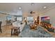 Bright living room with hardwood floors, comfy seating, and a large TV at 676 Allegheny Dr, Sun City Center, FL 33573