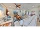 Bright living room featuring hardwood floors, comfy sofas, and a coffee table at 676 Allegheny Dr, Sun City Center, FL 33573