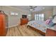 Spacious main bedroom with king bed, dresser, and large windows at 676 Allegheny Dr, Sun City Center, FL 33573
