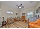 Home office with built-in wooden desk and comfortable chair at 676 Allegheny Dr, Sun City Center, FL 33573