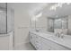 Modern bathroom boasts double vanity and large walk-in shower at 7258 Bridgeport Ln, Englewood, FL 34224