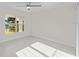 Spacious bedroom with large window and ceiling fan at 7258 Bridgeport Ln, Englewood, FL 34224