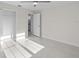 Well-lit bedroom with a closet and bathroom access at 7258 Bridgeport Ln, Englewood, FL 34224