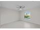 Light-filled bedroom with tile floors and pool view at 7258 Bridgeport Ln, Englewood, FL 34224