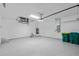 Finished garage with epoxy floor and ample storage at 7258 Bridgeport Ln, Englewood, FL 34224