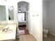 Main bathroom features a toilet, sink, and access to the bedroom at 8408 Canterbury Lake Blvd, Tampa, FL 33619