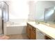Bathroom boasts a soaking tub, vanity with sink, and a shower at 8408 Canterbury Lake Blvd, Tampa, FL 33619