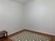 Small bedroom with wood floors and a small rug at 8408 Canterbury Lake Blvd, Tampa, FL 33619