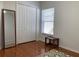 Bedroom with a full-length mirror and double doors at 8408 Canterbury Lake Blvd, Tampa, FL 33619