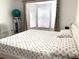Bedroom with a king-size bed and window with blinds at 8408 Canterbury Lake Blvd, Tampa, FL 33619