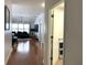 Bright entryway with hardwood floors and views into the living room and an office at 8408 Canterbury Lake Blvd, Tampa, FL 33619