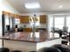 Kitchen with granite island, stainless steel appliances, and wood cabinets at 8408 Canterbury Lake Blvd, Tampa, FL 33619