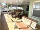 Relaxing screened patio with seating and outdoor kitchen at 8408 Canterbury Lake Blvd, Tampa, FL 33619