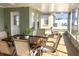 Screened patio with dining set and backyard view at 8408 Canterbury Lake Blvd, Tampa, FL 33619