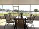 Screened porch overlooking lake and backyard at 8408 Canterbury Lake Blvd, Tampa, FL 33619