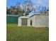 Backyard with multiple storage buildings at 905 10Th Sw St, Ruskin, FL 33570