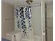 Small bathroom with shower, toilet and shelving at 905 10Th Sw St, Ruskin, FL 33570