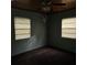 Bright bedroom with carpeted floor and two windows at 905 10Th Sw St, Ruskin, FL 33570