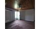 Living room with wood-paneled ceiling and carpeted floor at 905 10Th Sw St, Ruskin, FL 33570