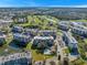 Aerial view of a condo community with pool, golf course, and lake at 960 Starkey Rd # 5301, Largo, FL 33771