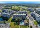 Aerial view of community with pool, golf course, and multiple buildings at 960 Starkey Rd # 5301, Largo, FL 33771