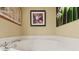 Relaxing bathroom with a large garden tub and neutral color palette at 960 Starkey Rd # 5301, Largo, FL 33771