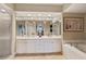 Bathroom with double vanity, soaking tub, and separate shower at 960 Starkey Rd # 5301, Largo, FL 33771