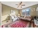 Relaxing bedroom with a comfy couch, large window, and colorful rug at 960 Starkey Rd # 5301, Largo, FL 33771