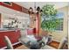 Bright dining area with glass table and hardwood floors at 960 Starkey Rd # 5301, Largo, FL 33771