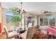 Bright dining room with glass table and hardwood floors at 960 Starkey Rd # 5301, Largo, FL 33771