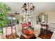 Spacious dining area with hardwood floors, a chandelier, and view of the balcony at 960 Starkey Rd # 5301, Largo, FL 33771