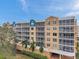 Exterior view of the building with lush landscaping at 960 Starkey Rd # 5301, Largo, FL 33771