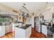 Modern kitchen with stainless steel appliances and an island at 960 Starkey Rd # 5301, Largo, FL 33771