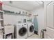Well-equipped laundry room with washer, dryer, and ample storage at 960 Starkey Rd # 5301, Largo, FL 33771