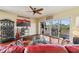 Living room with hardwood floors, balcony access, and comfy seating at 960 Starkey Rd # 5301, Largo, FL 33771