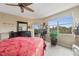 Main bedroom with a king-size bed, large window, and ceiling fan at 960 Starkey Rd # 5301, Largo, FL 33771