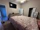 Main bedroom with a double bed and ensuite bathroom access at 9822 Carlsdale Dr, Riverview, FL 33578