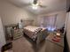 Bedroom with double bed, dresser, and ceiling fan at 9822 Carlsdale Dr, Riverview, FL 33578