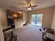Open floor plan with kitchen, living room, and sliding glass door to backyard at 9822 Carlsdale Dr, Riverview, FL 33578