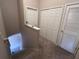 Upstairs hallway with multiple closets and carpeted floors at 9822 Carlsdale Dr, Riverview, FL 33578