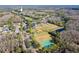 Aerial view of community with park, pond, and homes at 12113 Marblehead Dr, Tampa, FL 33626